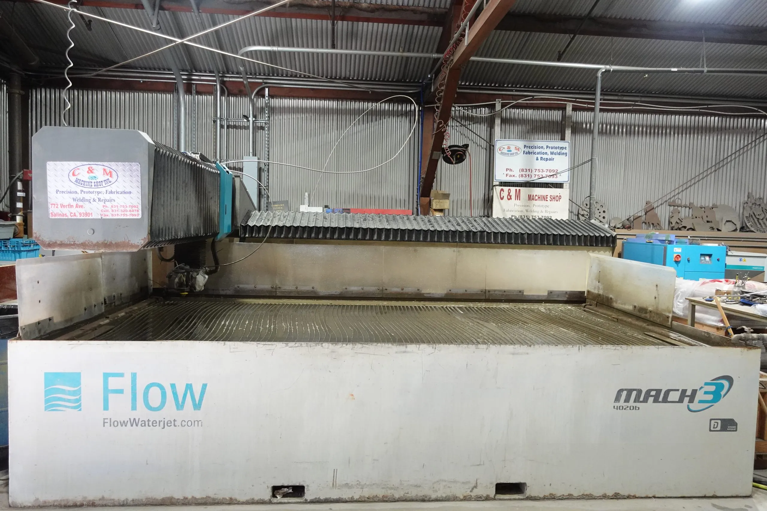 Flow waterjet cutting table in the C&M shop