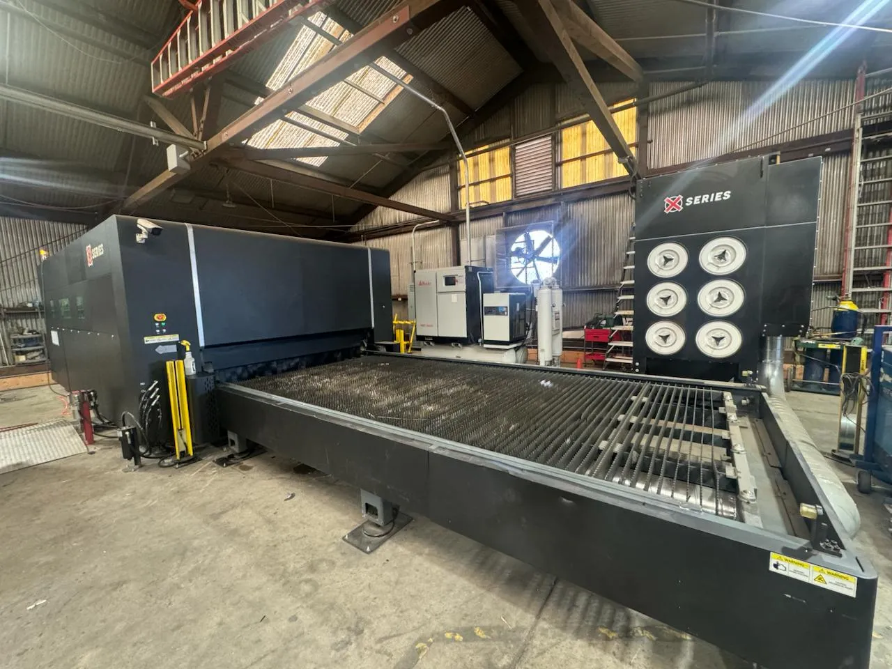 Fiber laser cutting system in the C&M shop